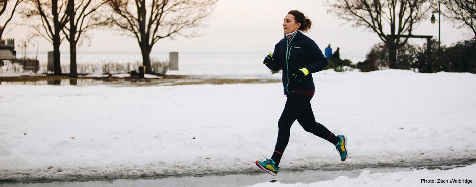 Emily runs along the Burlington, VT waterfront in February, while training for the Vermont City Marathon. Photo credit: Zach Walbridge.